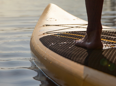 foot on paddleboard